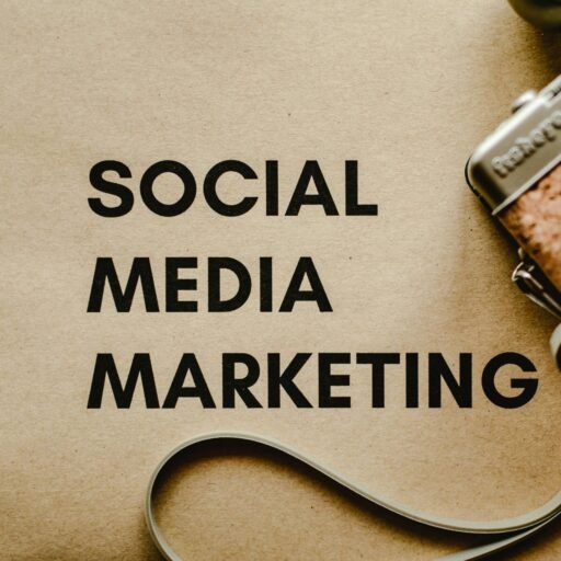 A vintage camera on brown paper with 'SOCIAL MEDIA MARKETING' text, perfect for marketing visuals.